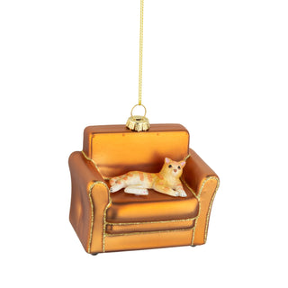 Glass and resin cat on sofa ornament